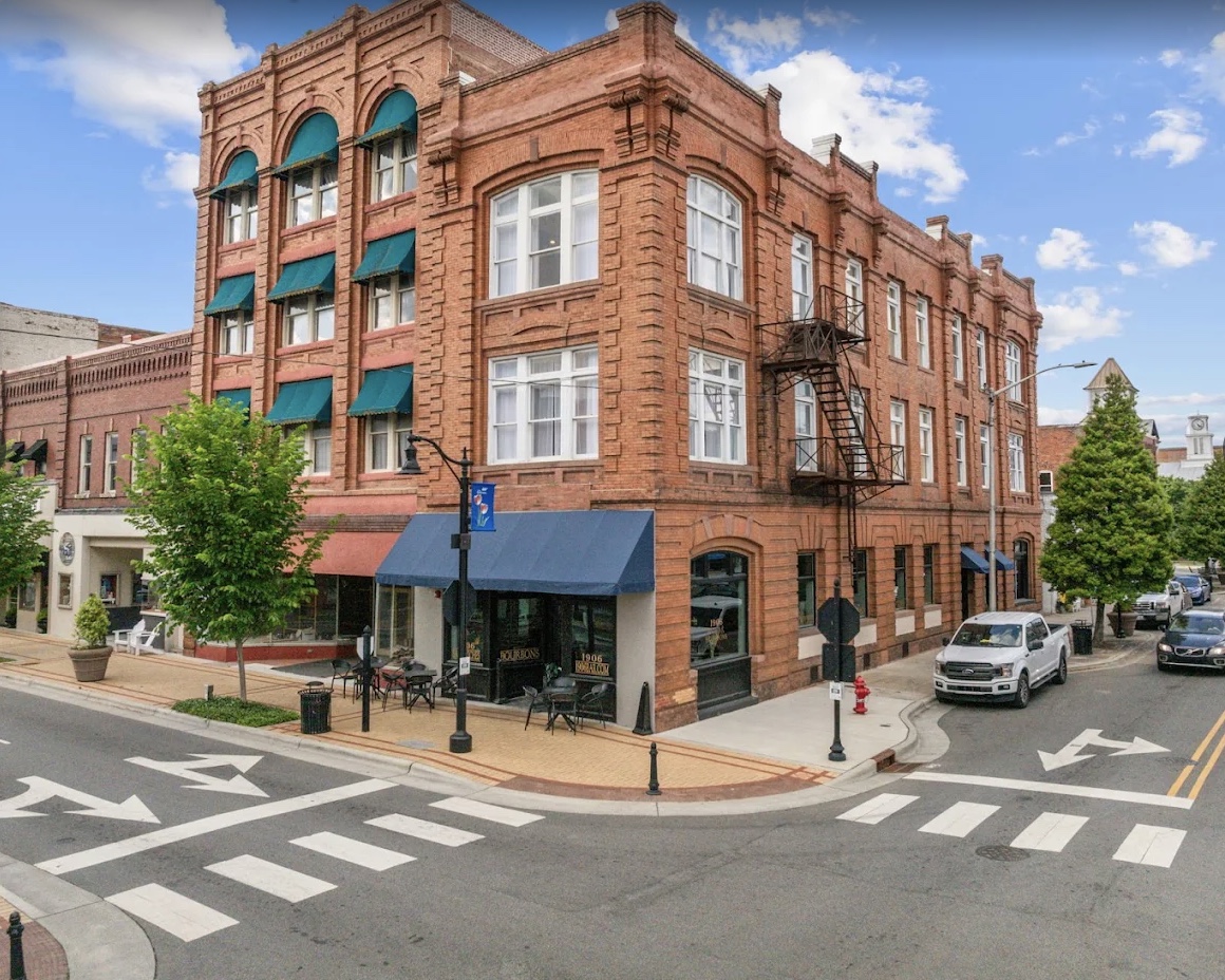 The West Main — a historic 1906 red-brick bank building on the corner of West Main Street, Washington, North Carolina